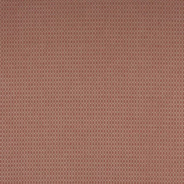 Close-up of a muted terracotta red geometric woven fabric with tiny lattice pattern