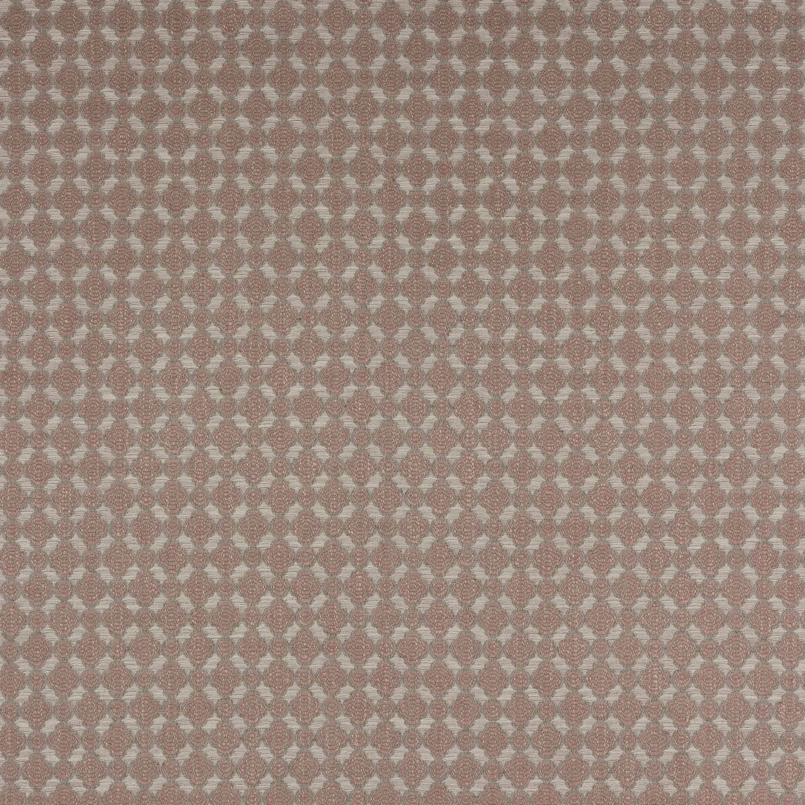 Close-up of dusty rose geometric woven fabric with pale accents