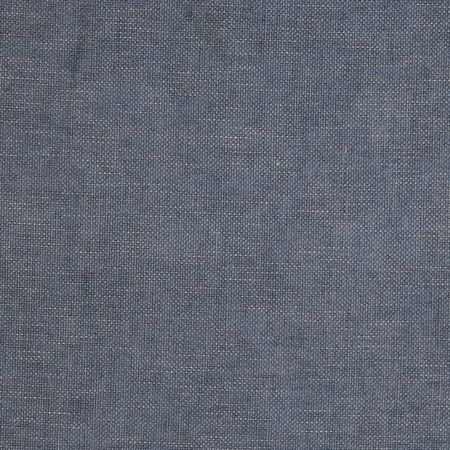 Close-up of a slate navy woven plain fabric with fine textured slub