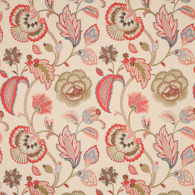 Large floral fabric with red, sienna and blush motifs on a pale ground