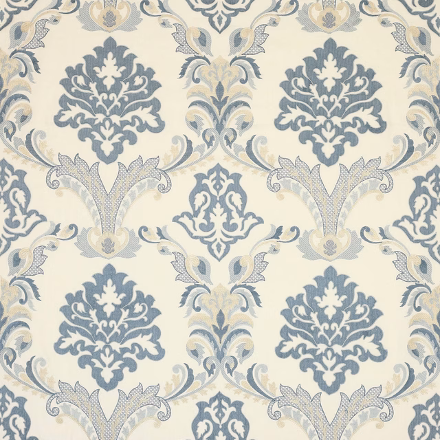 Blue and cream damask fabric with large scrolling medallions and woven texture