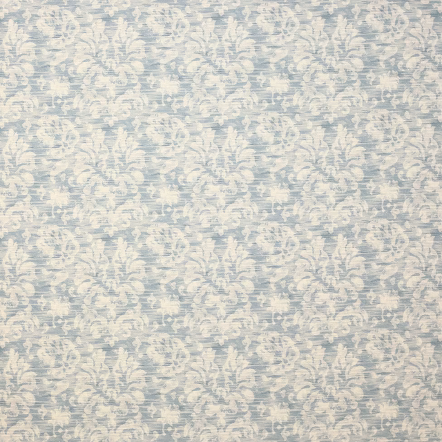 Pale blue damask fabric with creamy scroll motifs and a lightly textured weave