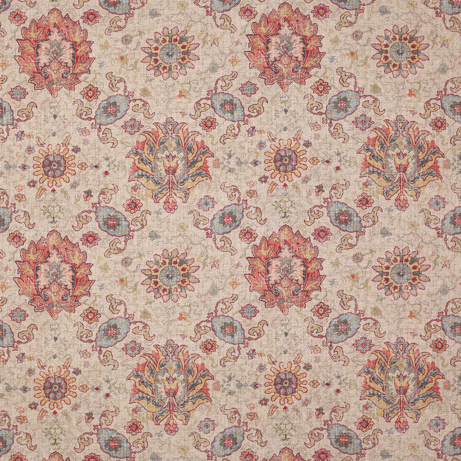 Large-scale floral and paisley fabric in muted red, blue and sand tones