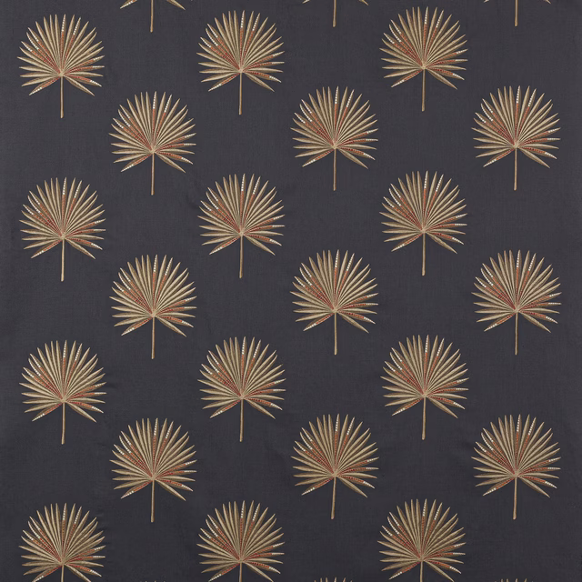 Charcoal fabric swatch with repeated gold and olive palm fan motif