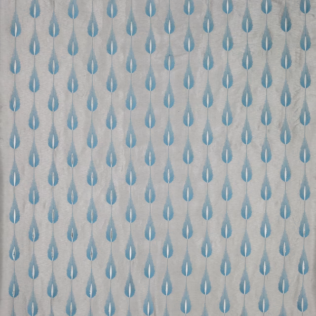 Small aqua teardrop motif on a pale textured fabric ground