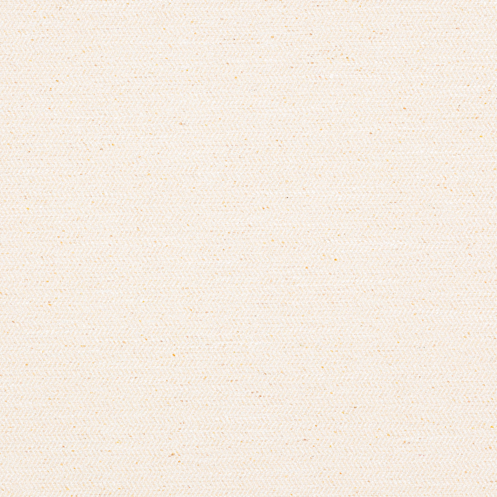 Close-up of warm cream woven fabric with tiny speckled slubs and soft texture