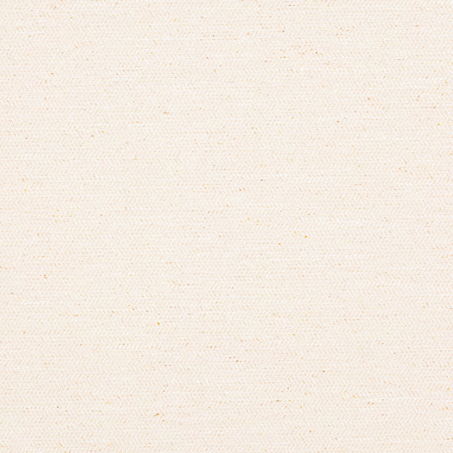 Close-up of warm cream woven fabric with tiny speckled slubs and soft texture