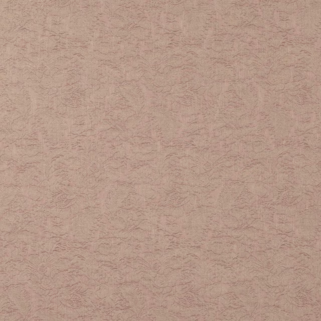 Soft blush pink textured fabric with a subtle woven all-over pattern