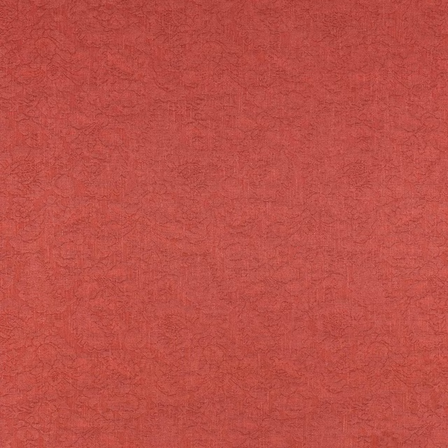 Soft russet red patterned fabric swatch with tonal woven damask texture