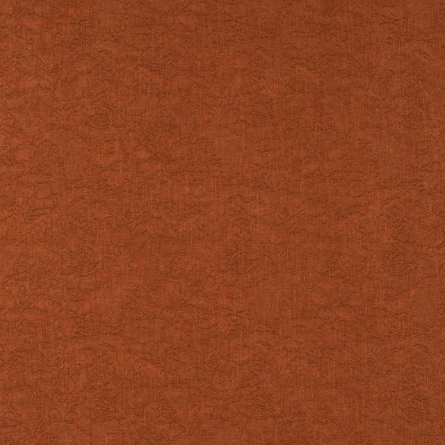 Burnt tomato-red woven fabric with fine tonal floral pattern and dry textured surface