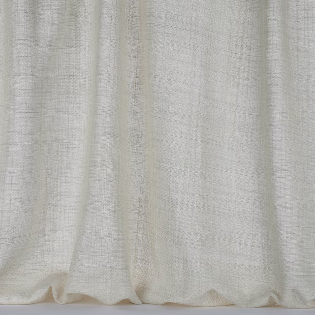 Warm cream woven curtain fabric with a fine crosshatch texture and soft folds