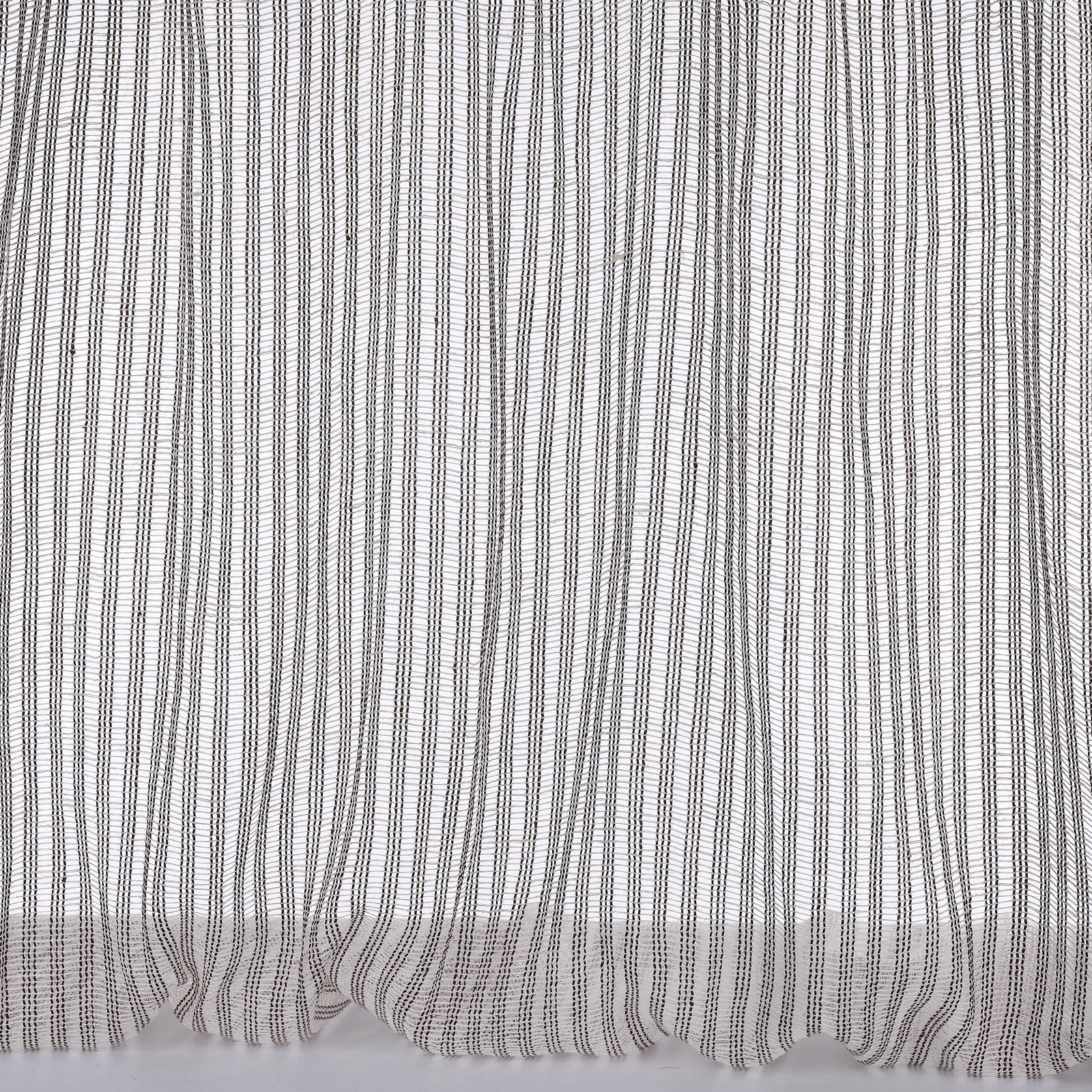 Pale linen fabric with fine vertical grey pinstripes and soft gathered hem