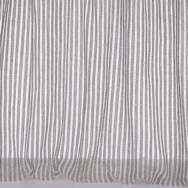 Pale linen fabric with fine vertical grey pinstripes and soft gathered hem