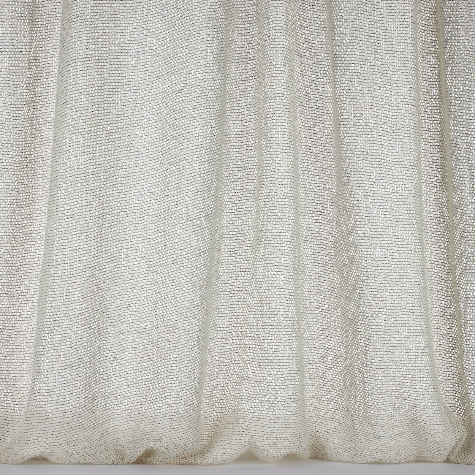 Soft warm beige woven fabric with fine textured folds