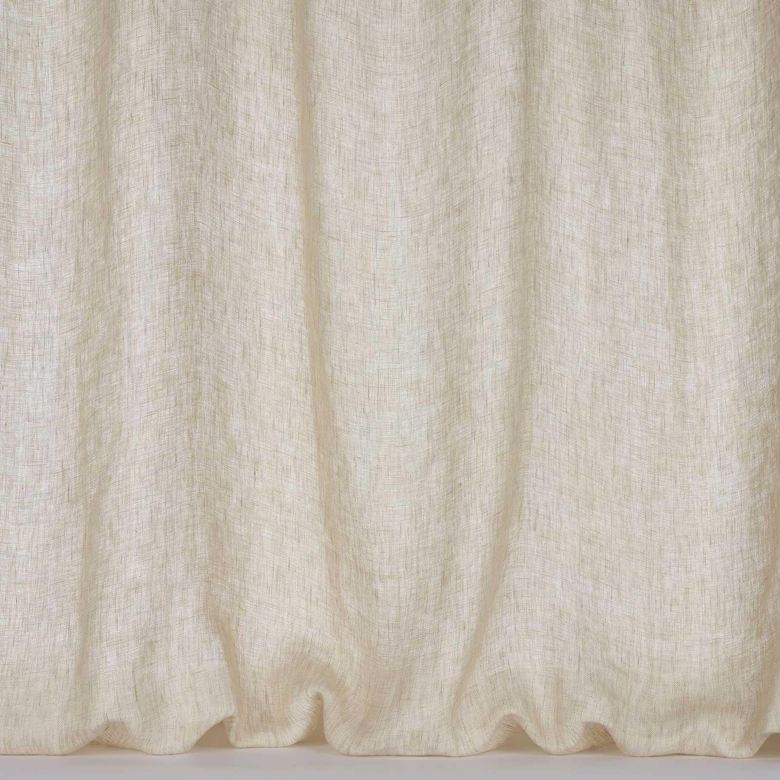 Pale pearl cream linen curtain fabric with soft slubbed texture and gentle folds