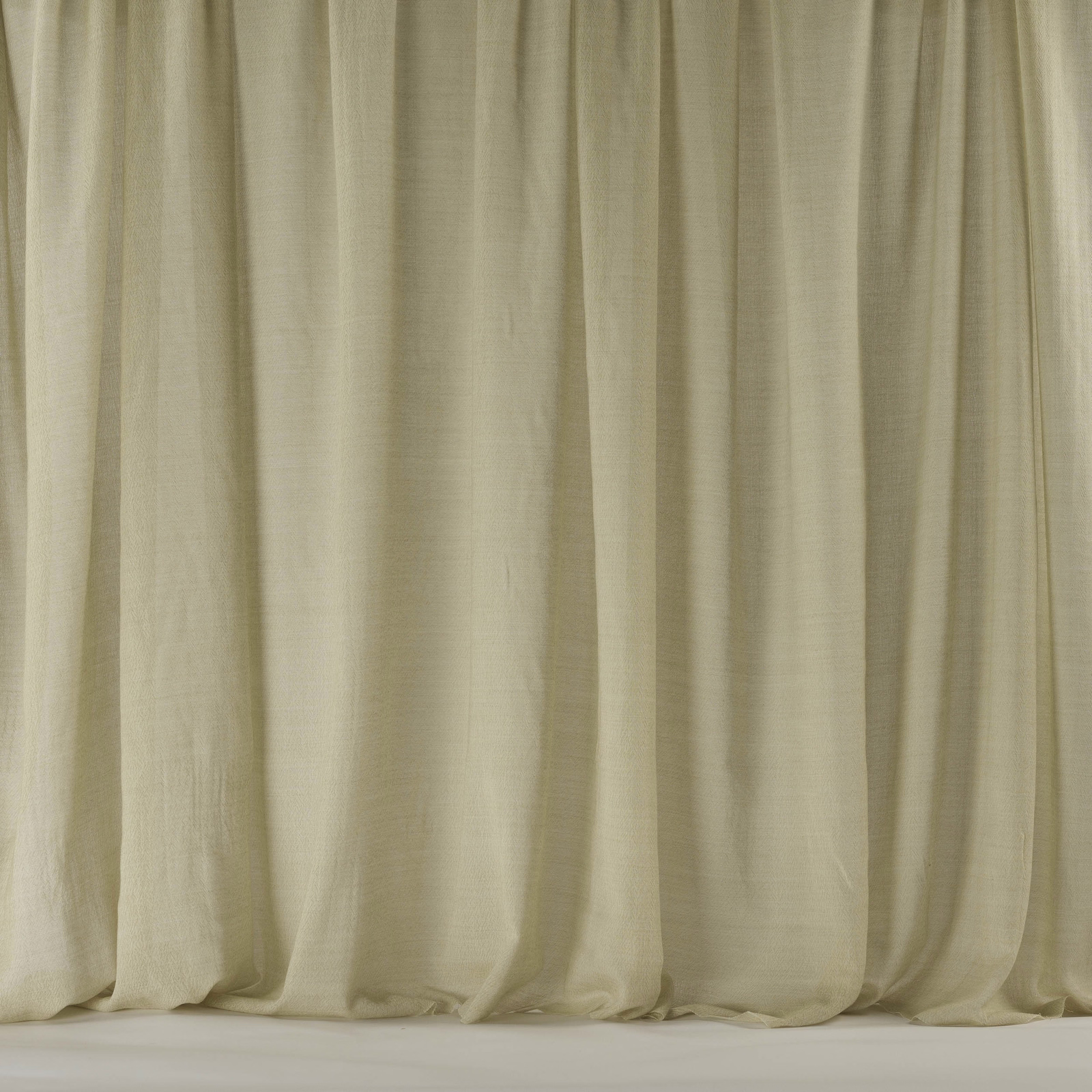 Warm sand cream wool fabric hanging in soft vertical folds