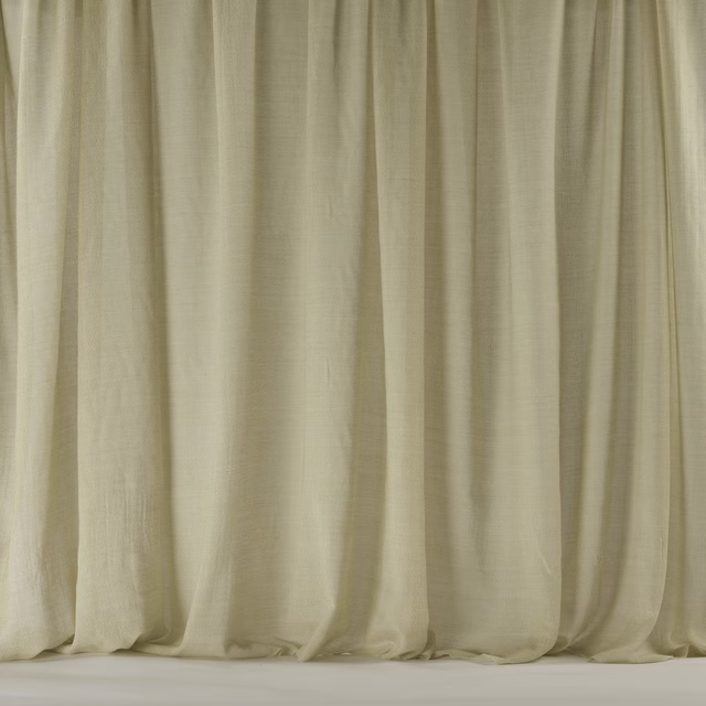 Warm sand cream wool fabric hanging in soft vertical folds