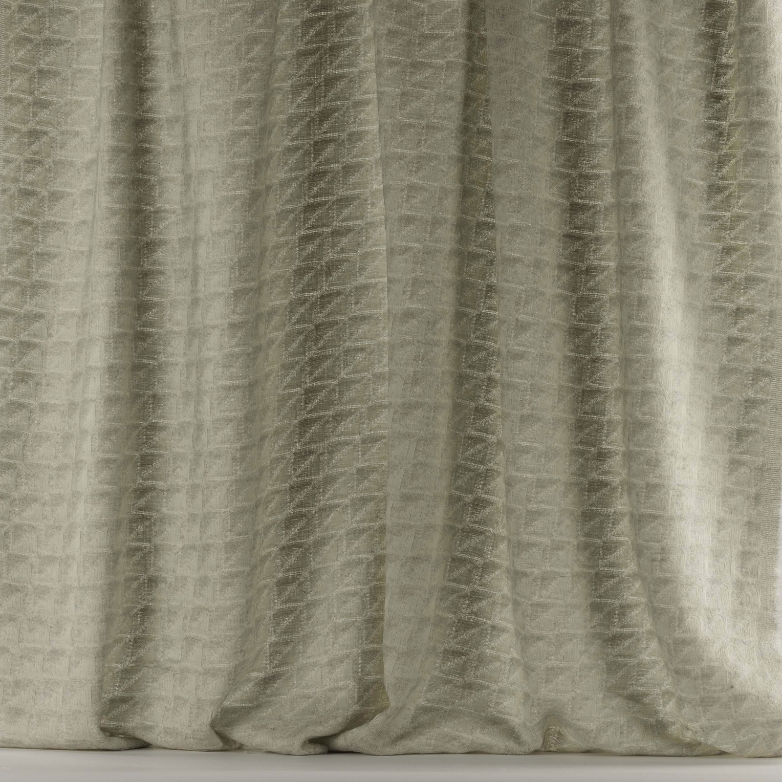 Pale gull-beige woven fabric with subtle geometric texture and soft vertical folds