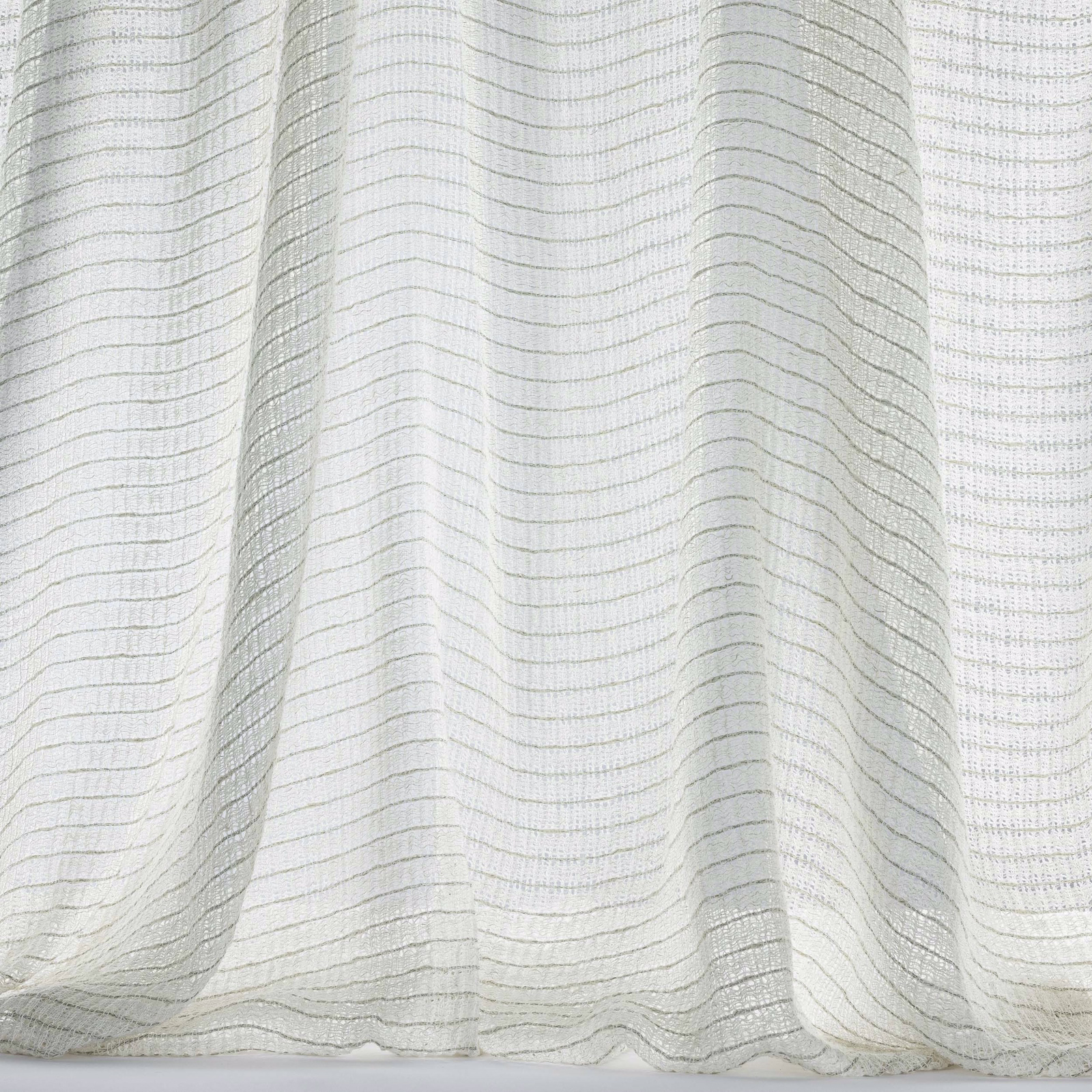 Soft ivory striped fabric with fine wavy lines and gentle folds