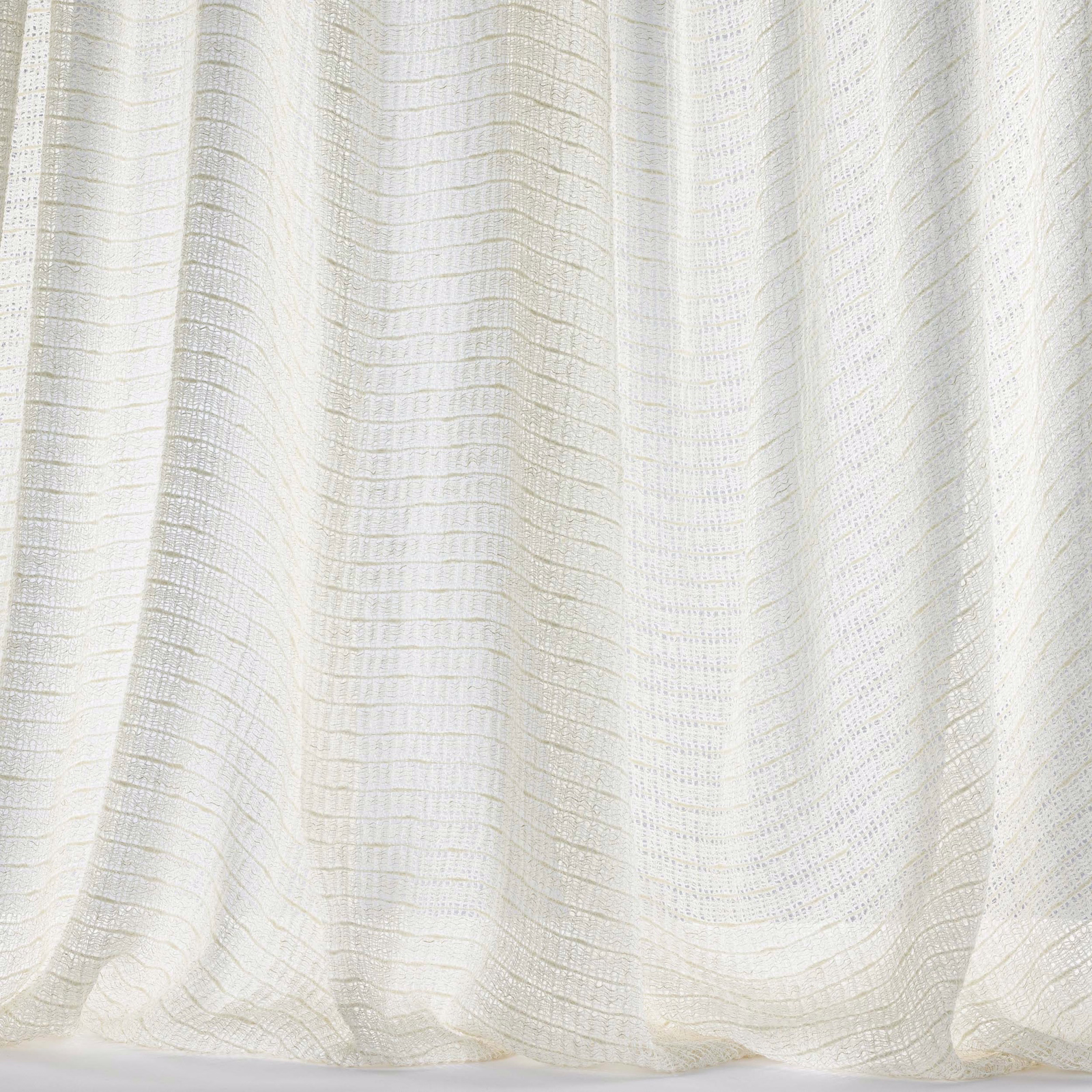 Pale ivory woven fabric with fine horizontal striation and soft drape