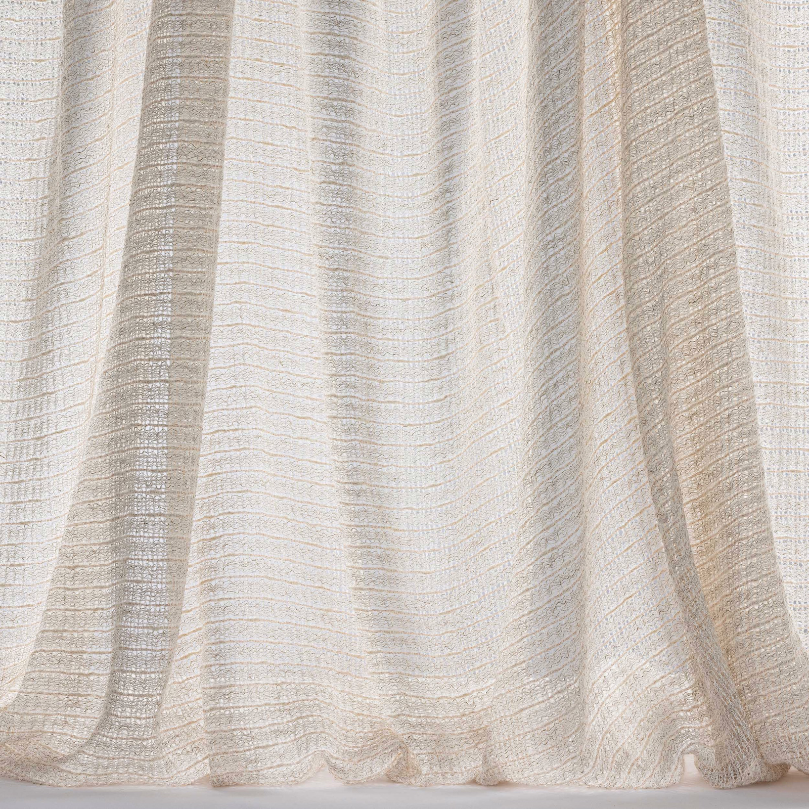 Pale shell beige striped sheer fabric with soft woven texture and gentle folds