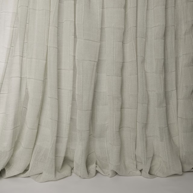 Soft ivory cream wool fabric with subtle woven grid texture and draped folds