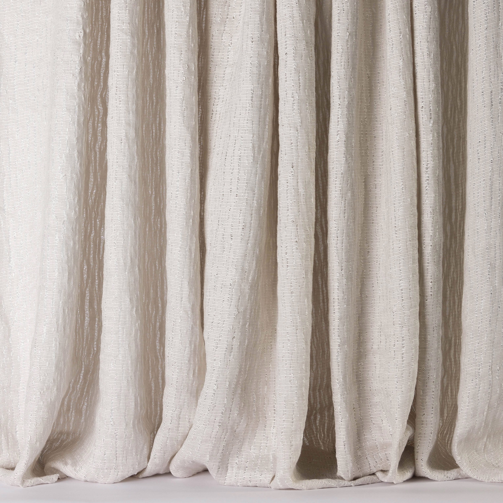 Cream linen fabric with soft vertical striations and a natural draped texture