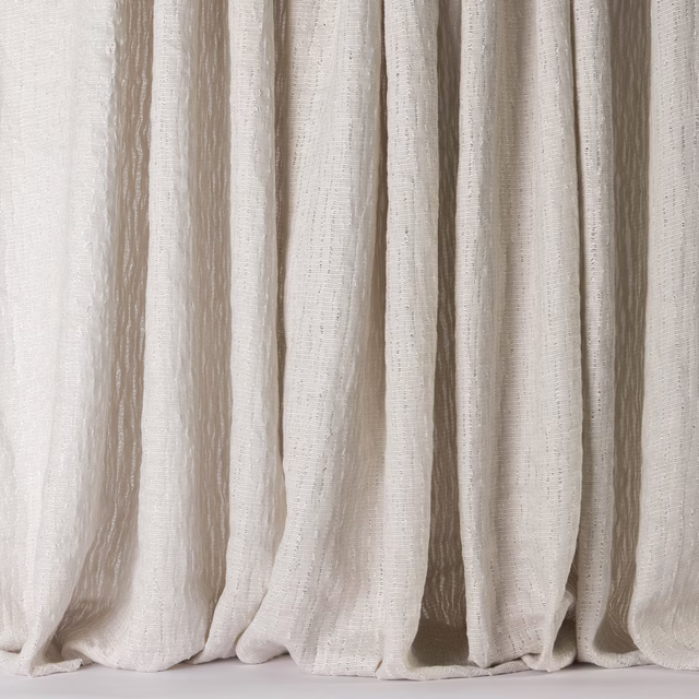 Cream linen fabric with soft vertical striations and a natural draped texture