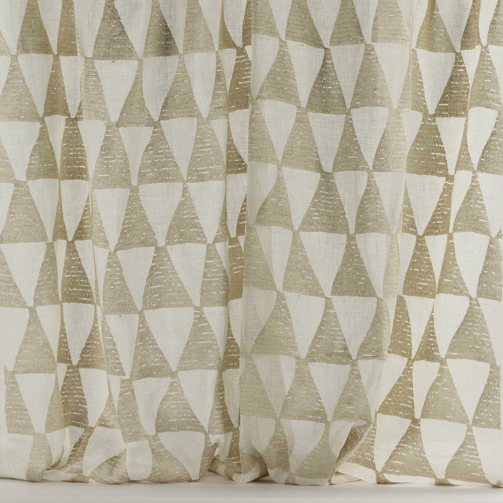 Warm shell-beige geometric triangle fabric with a soft woven texture