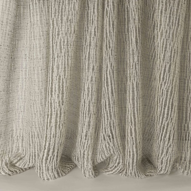 Textured vertical stripe fabric in soft taupe-ebony linen blend folds