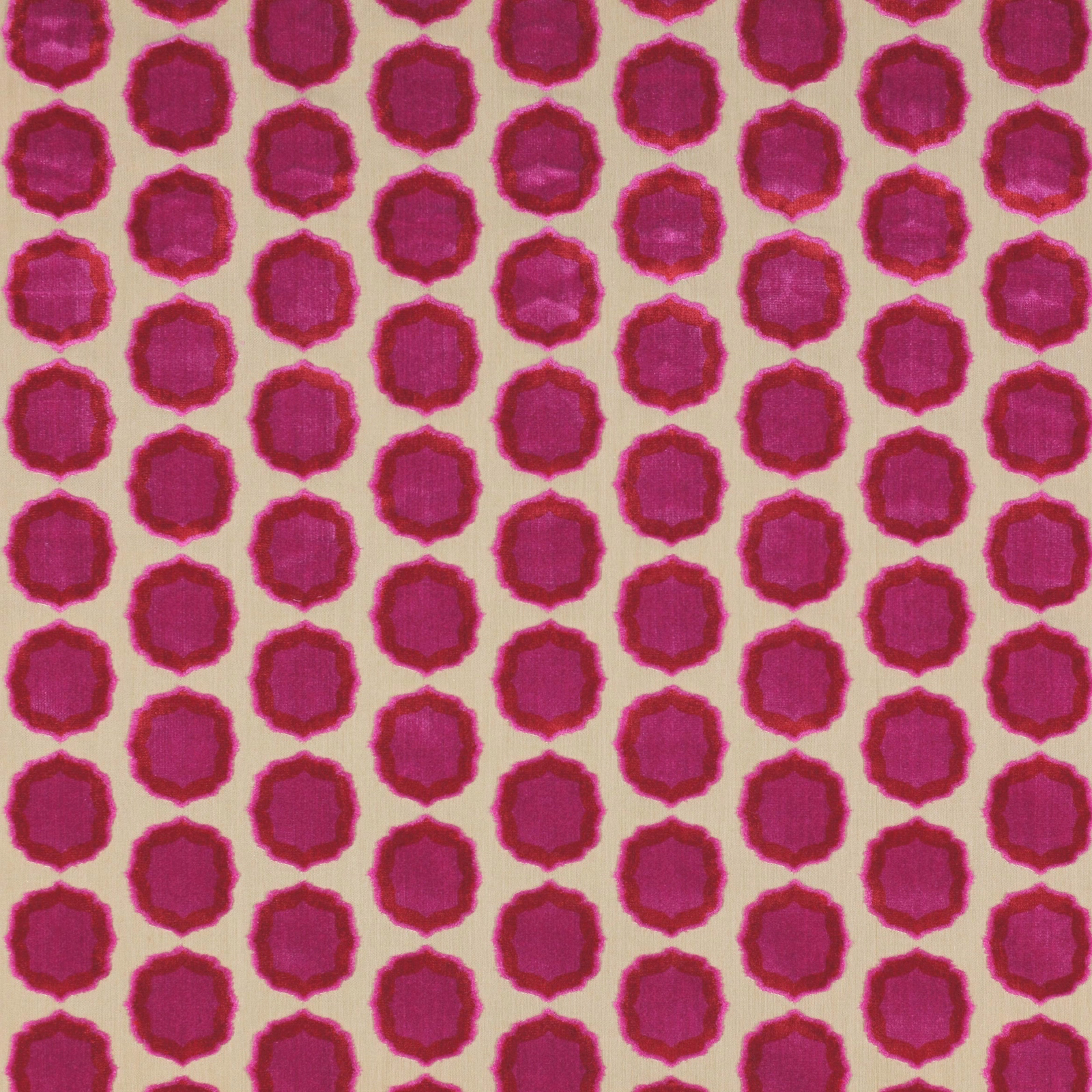 Close-up of rose pink geometric spots with orange-red edges on pale ground