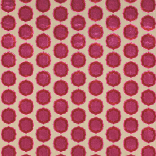 Close-up of rose pink geometric spots with orange-red edges on pale ground
