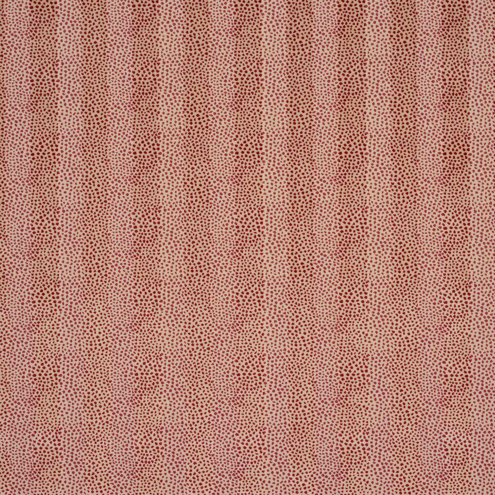 Close-up of beige fabric with tiny red dotted pattern and soft vertical repeat