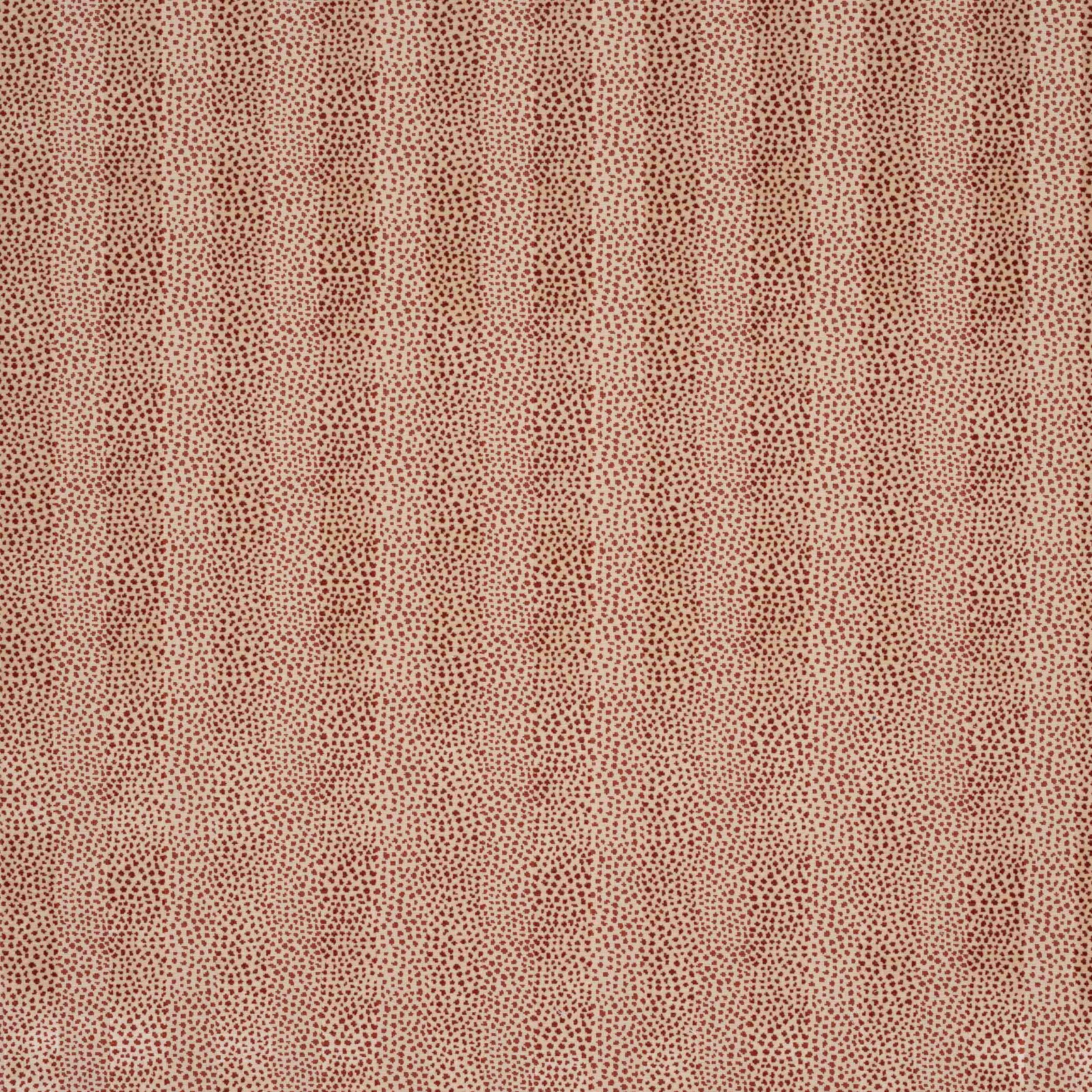 Close-up of tiny tomato-red damask pattern on a pale beige fabric ground