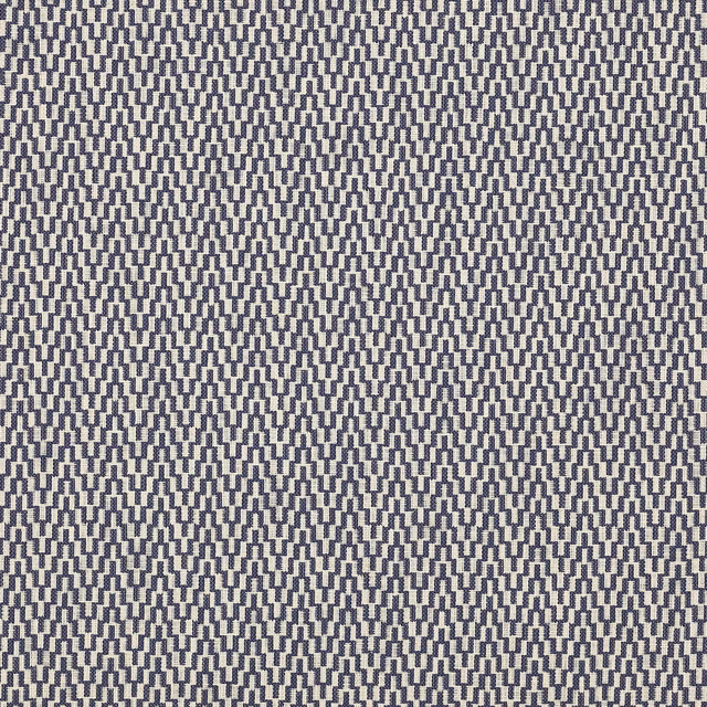 Close-up of a small indigo geometric weave on a pale ground