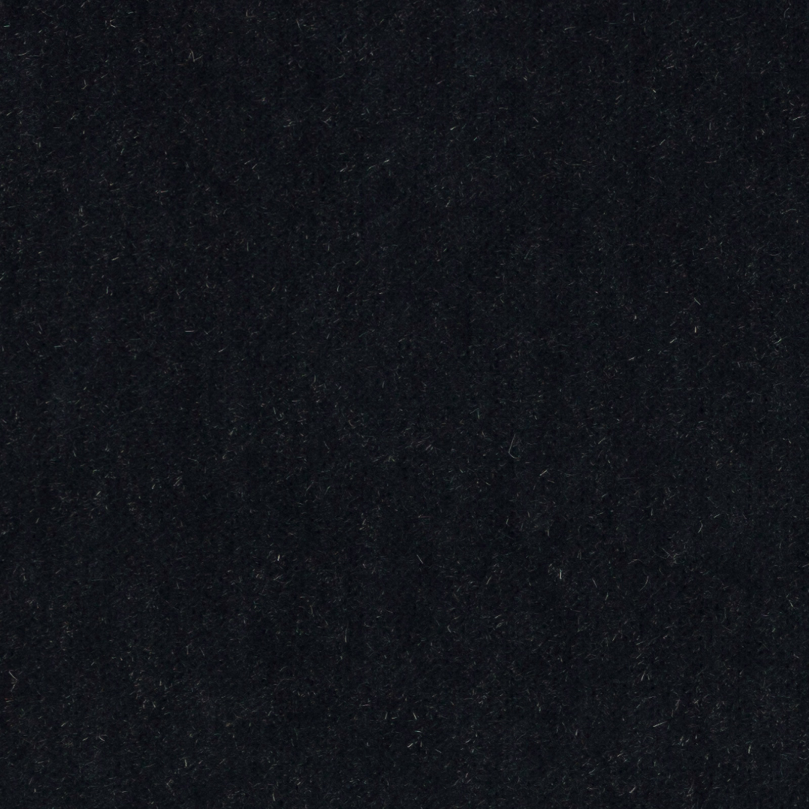 Close-up of very deep midnight blue mohair fabric with a soft, velvety pile