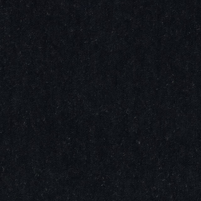 Close-up of very deep midnight blue mohair fabric with a soft, velvety pile