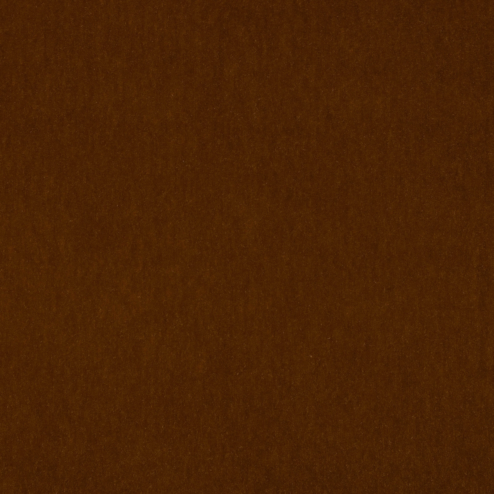 Close-up of deep tobacco brown mohair fabric with a soft velvety pile
