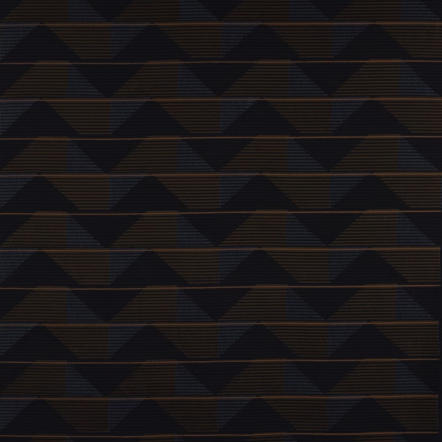 Close-up of Seki Marine fabric showing deep marine geometric triangles with rust horizontal lines.