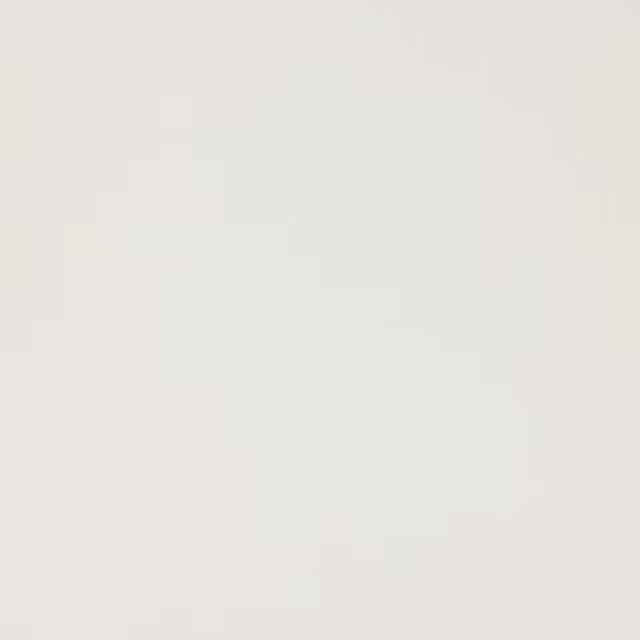 Soft ivory plain fabric swatch with a smooth, lightly lustrous surface