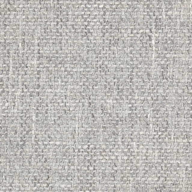 Close-up of softly textured charcoal grey woven fabric with pale flecks
