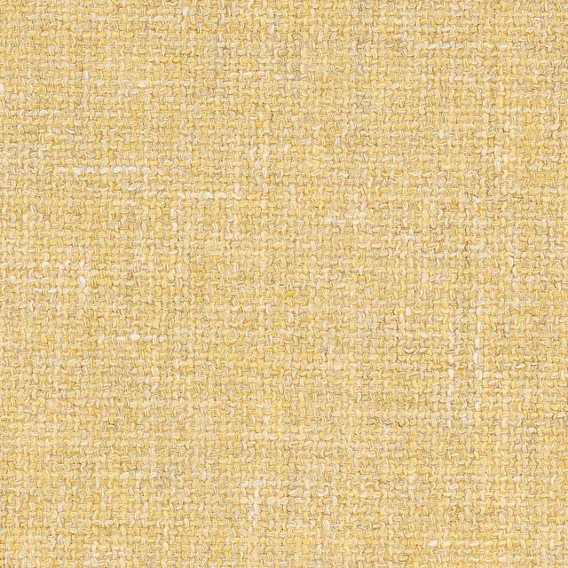 Soft marigold gold woven fabric with a small textured basket weave