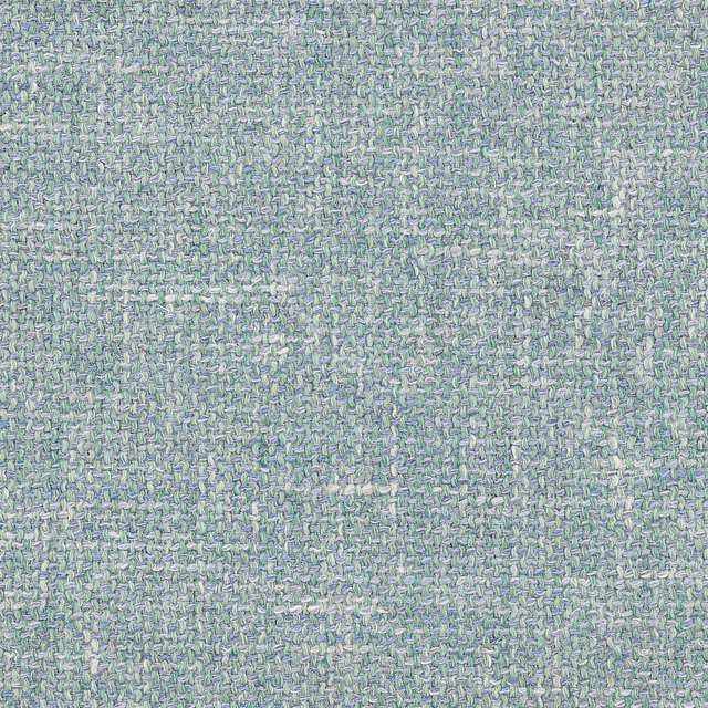 Close-up of a misty teal woven fabric with a speckled textured surface