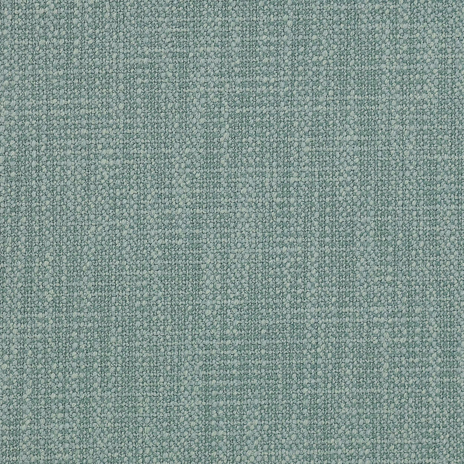Close-up of a softly textured sage green woven fabric with a fine nubby surface