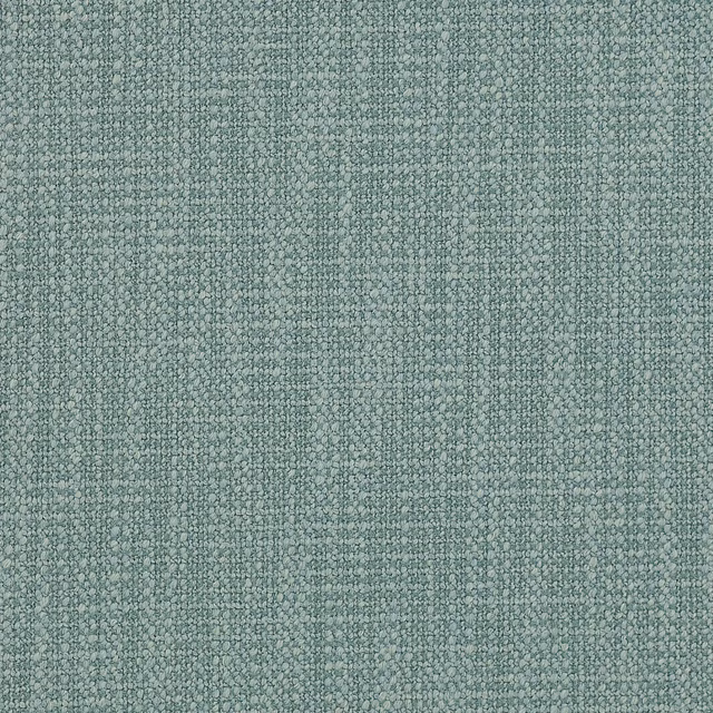 Close-up of a softly textured sage green woven fabric with a fine nubby surface