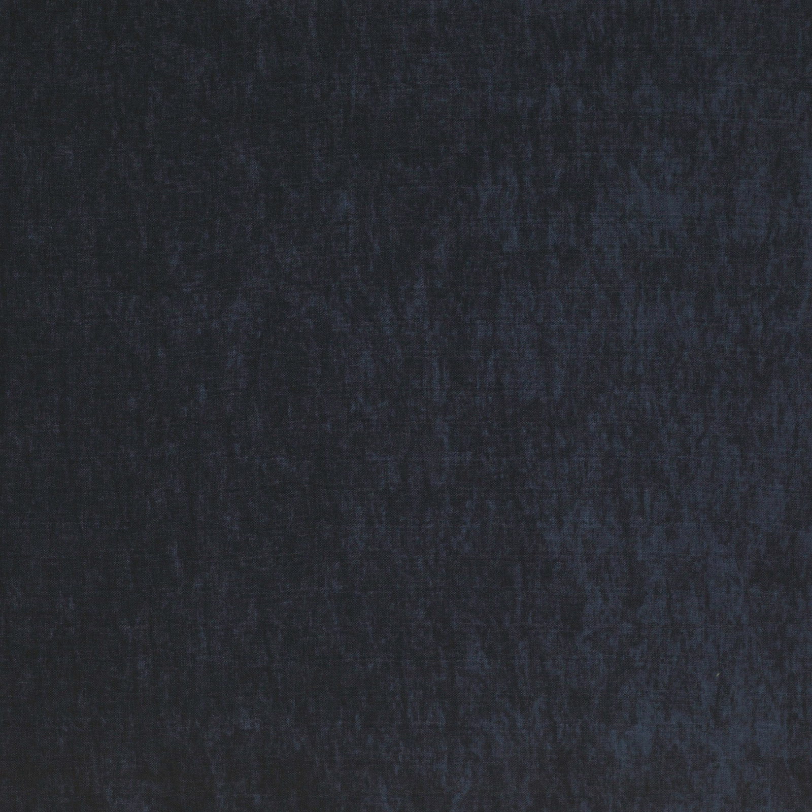 Close-up of deep indigo plain-woven fabric with a soft matte texture