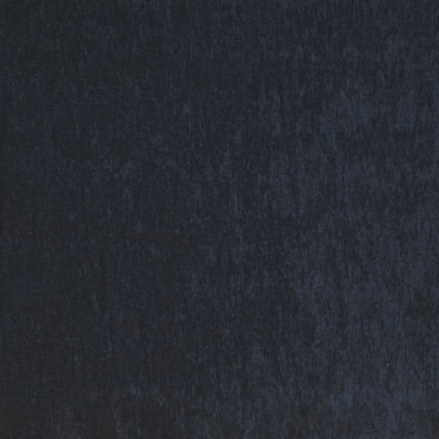 Close-up of deep indigo plain-woven fabric with a soft matte texture