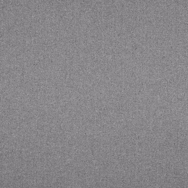 Close-up of cool charcoal grey herringbone woven fabric with fine zigzag texture