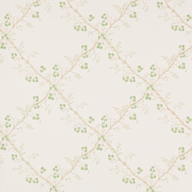 Pale cream wallpaper with diagonal branches and soft green leaf clusters