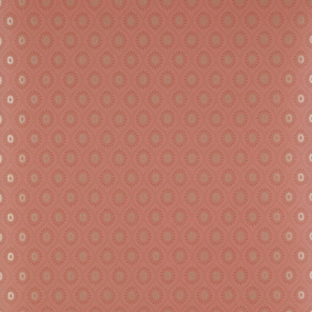 Dusty coral-red wallpaper with small cream and taupe floral medallions
